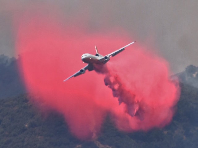 Surrounded by flames, California firefighters rescue US flag from wildfire